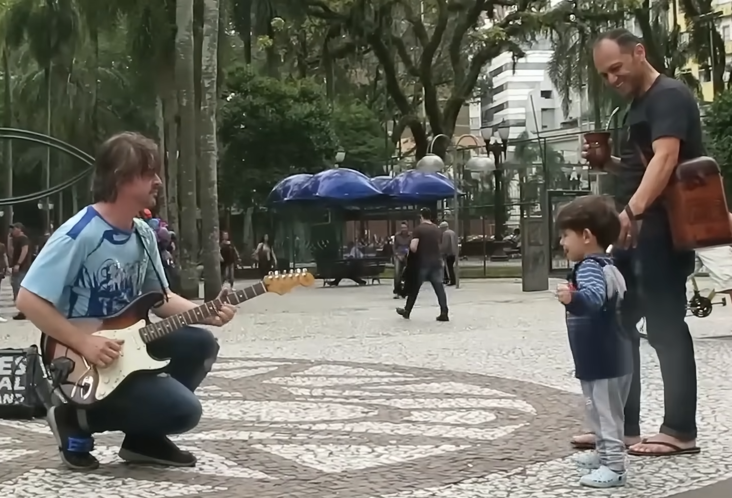 Street Musician Plays Dire Straits as Children Dance Along, and It’s Pure Joy