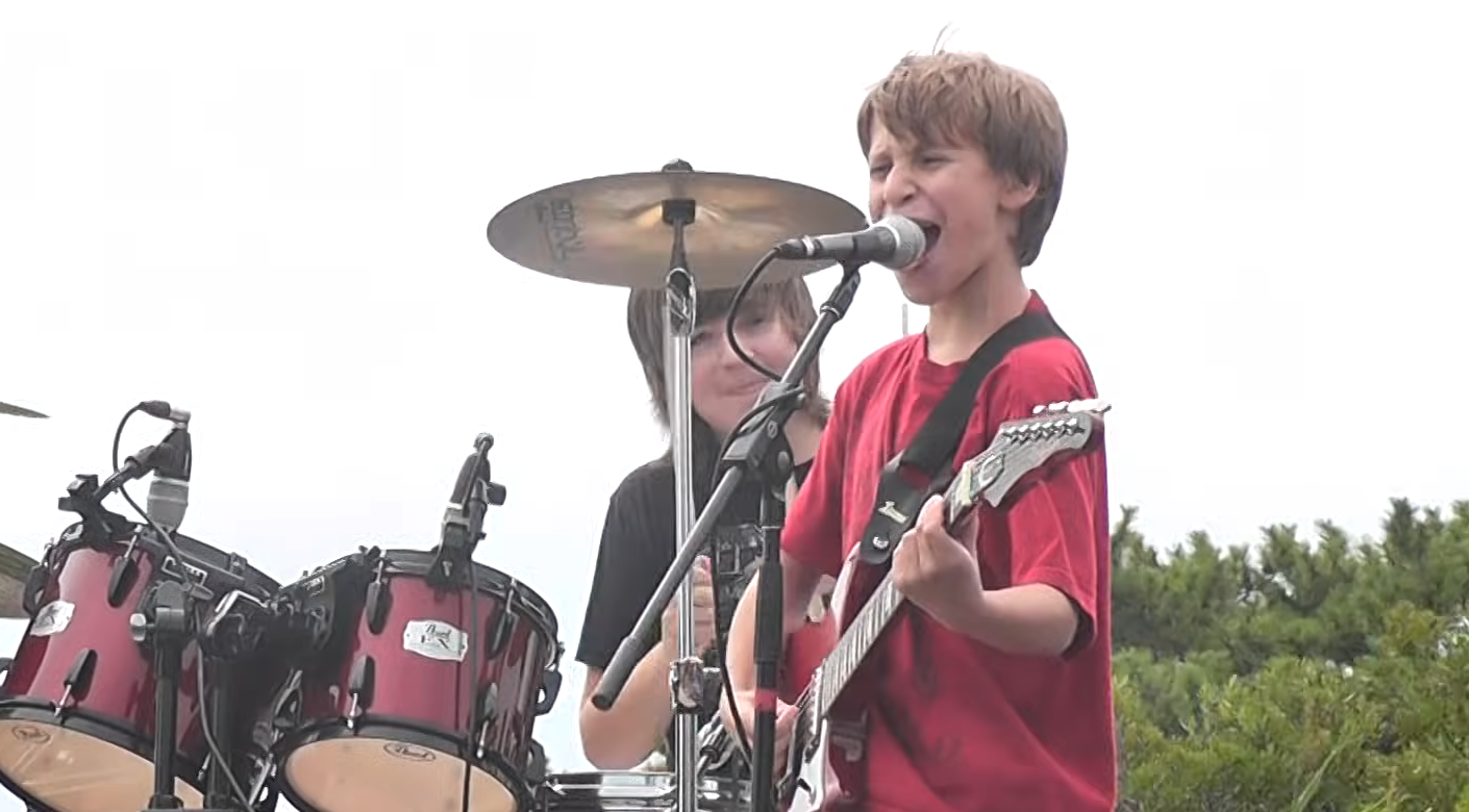You Expect a Fun Kids’ AC/DC Cover, Then You Hear the Singer’s Voice